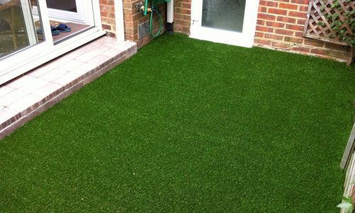 Artificial grass with a cobble stone steps.