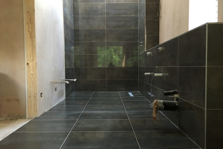 Wet room wall and floor tiling.